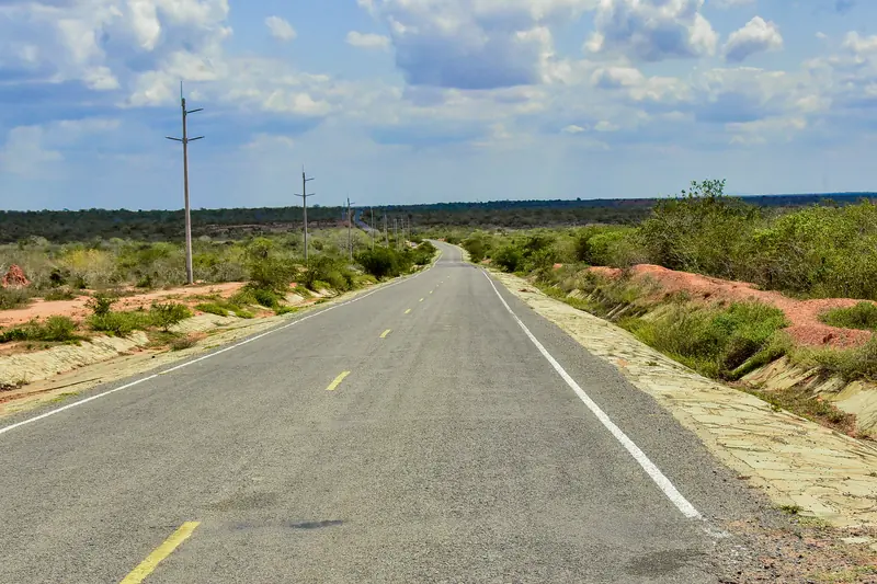 Nearby: the tarmac road towards the site