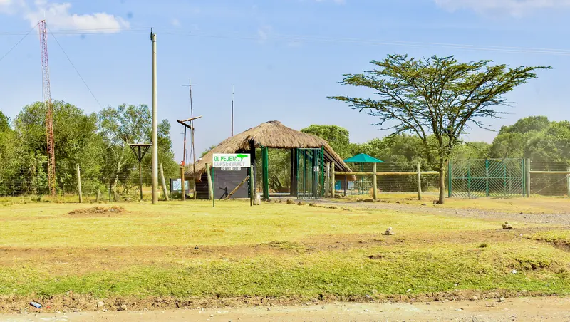 Nearby: an entrance gate along the road