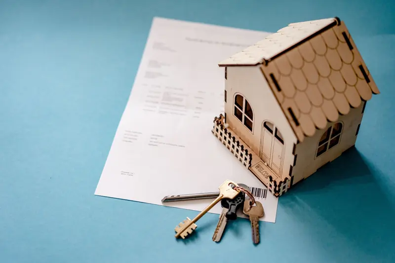A model house, keys and a contract